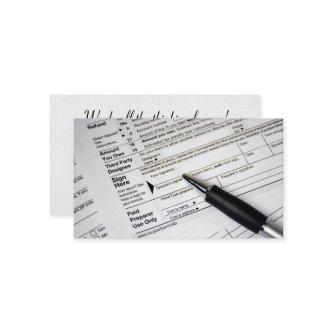 1040 income tax form with ink pen
