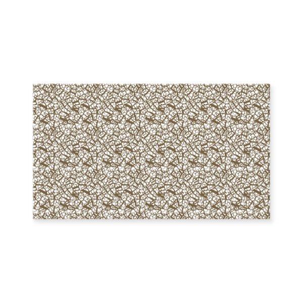 A brown rug with a geometric motif is partially co
