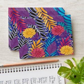 a colorful flower and leaves pattern on a blue bac envelope