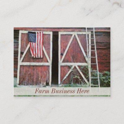 Antique Red Barn Doors With a Flag and Old Ladder