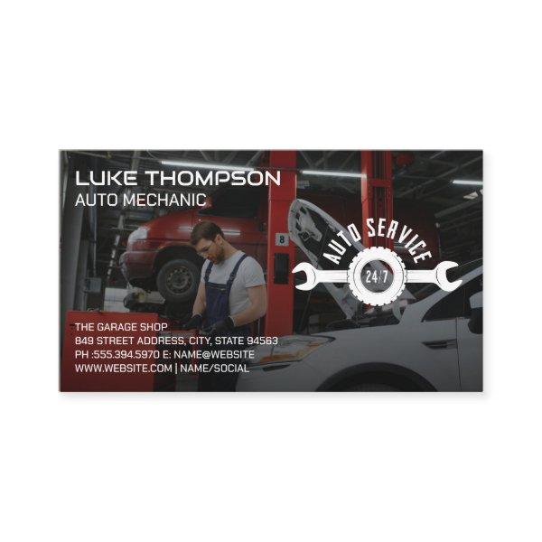 Auto Mechanic Working on Car Engine in Garage