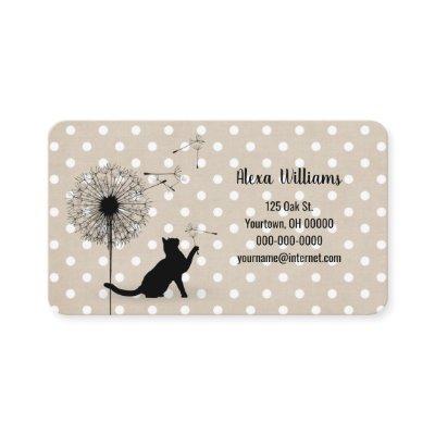 Black cat with dandelion on polka dots