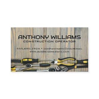 Builder Hand Tools on Wooden Table