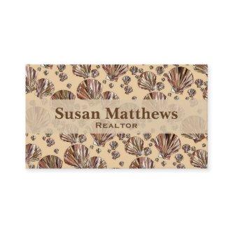 Cocoa and tan sea shells, caramel tan background