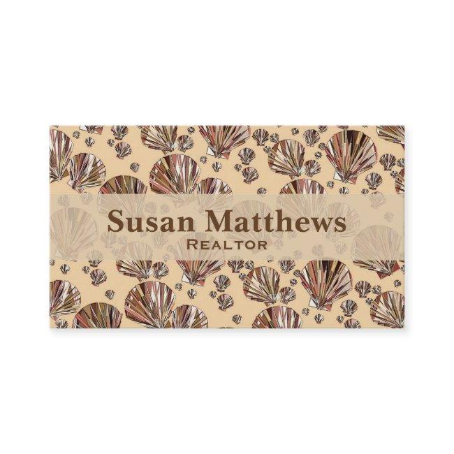 Cocoa and tan sea shells, caramel tan background