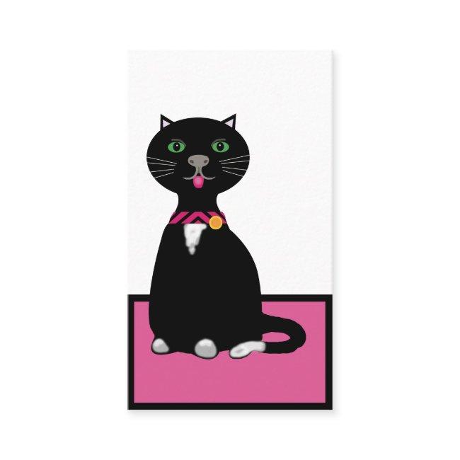 Cute black and white cat on a pink mat