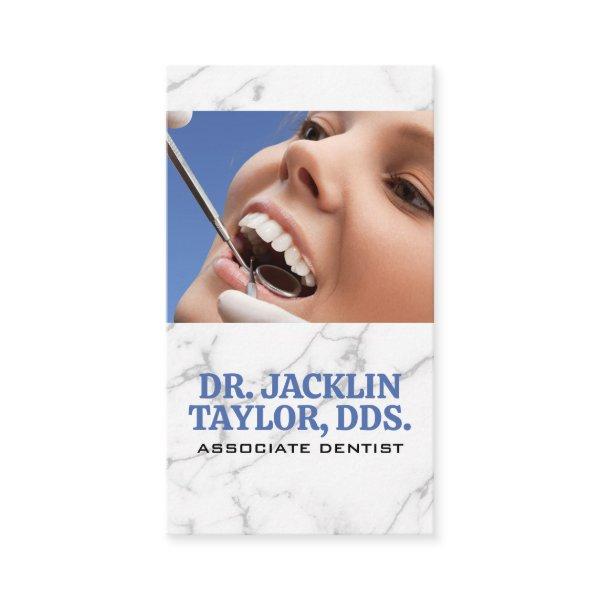 Dentist Inspecting Teeth