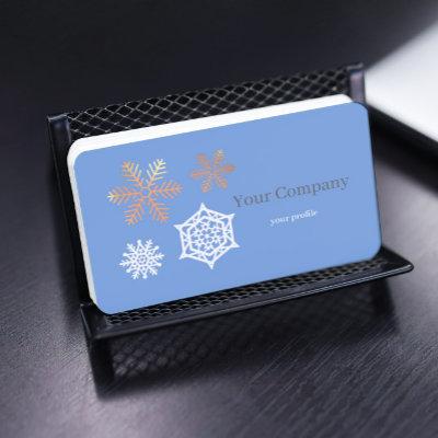 golden and white snowflakes in light blue