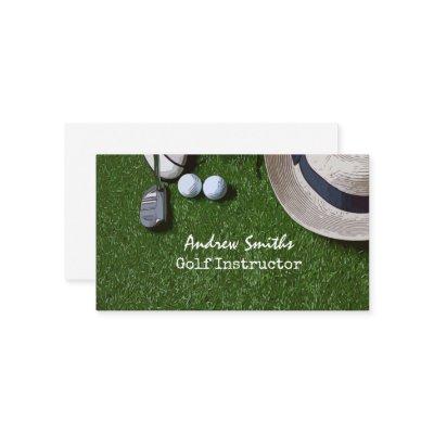 Golf ball shoe putter on green golfer business car