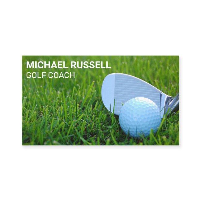 Golf Club and Ball in the Grass