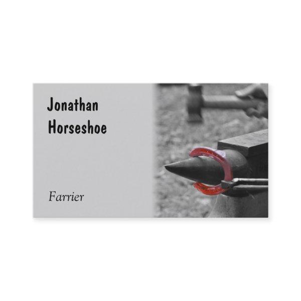 Hammering a red hot shoe on an anvil