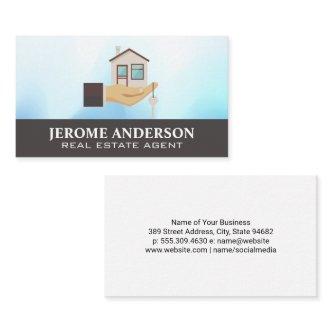 Hand Holding Home | Real Estate