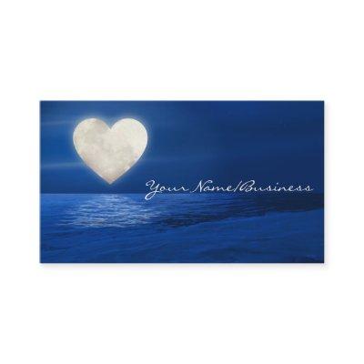 Heart Moon over Water with Snow Covered Beach