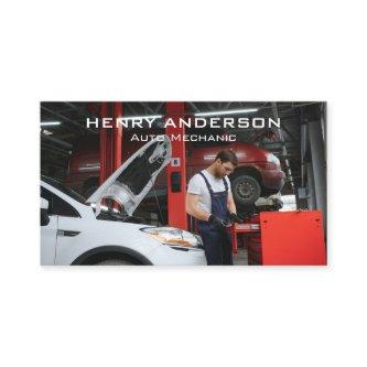Mechanic Working on Car Engine in Shop