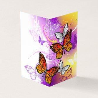 Monarch Butterflies on Purple Background