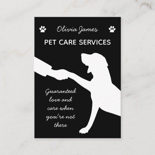Monochrome dog paw in hand pet care services