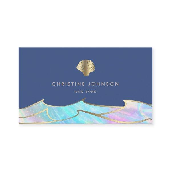 ocean waves and seashell logo on blue