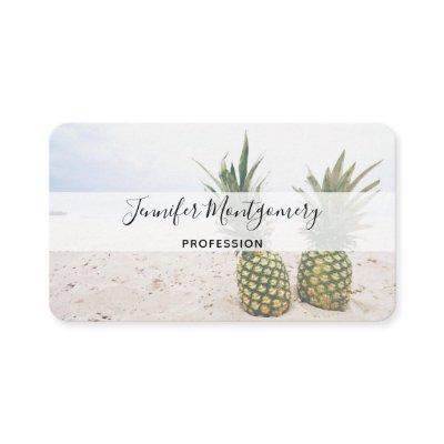 Photo of 2 Pineapples on a Beach