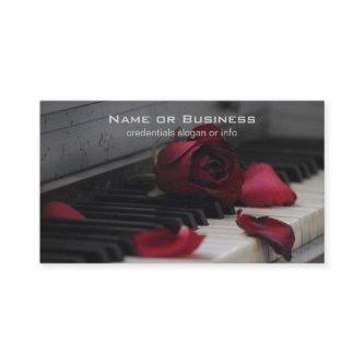 Piano Keys with a Red Rose