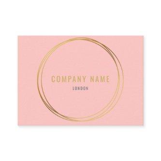 Pink background, gold effect rings, professional