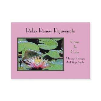 PINK WATER LILY AMONG LILY PADS