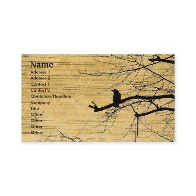 Raven on the Tree with wooden background Business