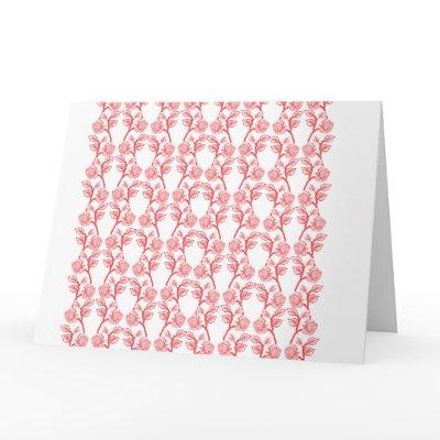 Red and pink wrapping paper featuring a repeating  card