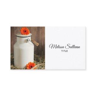 Rustic White Milk Jug with Orange Flowers Photo