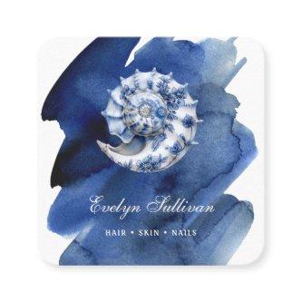 Seashell logo on blue watercolor