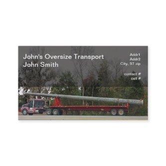 Semi hauling oversized concrete power pole