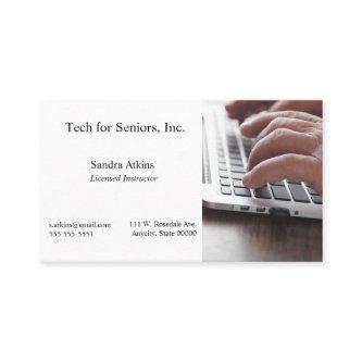 Senior man hands on laptop keyboard
