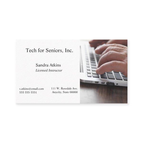 Senior man hands on laptop keyboard