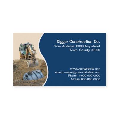 Septic tank being backfilled by a digger