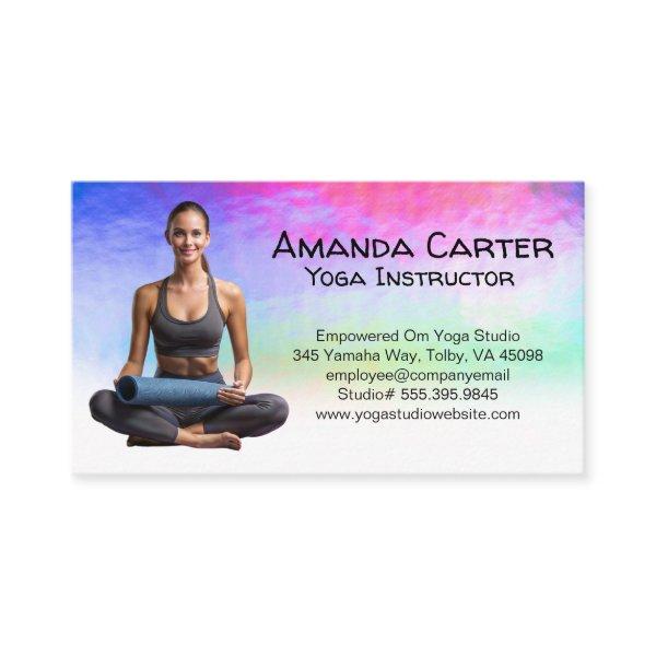 Smiling Woman Seated with Yoga Mat