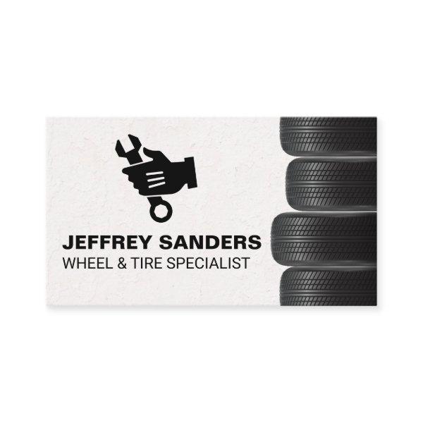 Stacked Tires | Mechanic Holding Wrench Logo