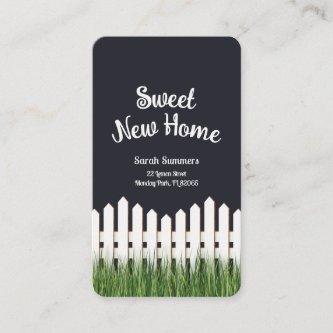 Sweet new home with white picket fence and grass