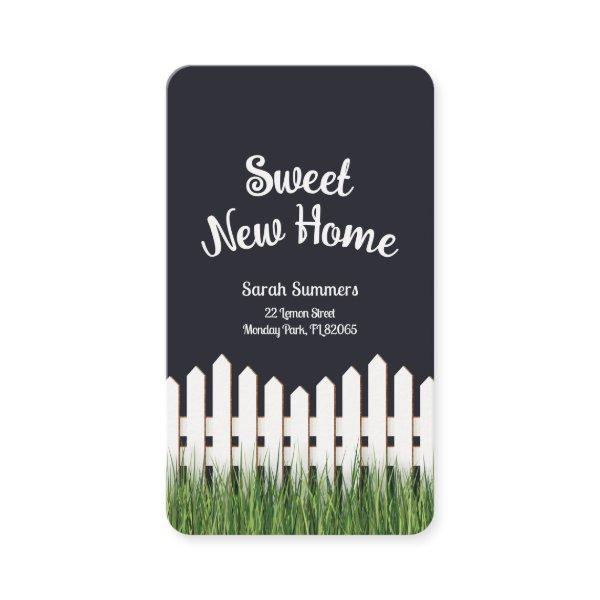 Sweet new home with white picket fence and grass