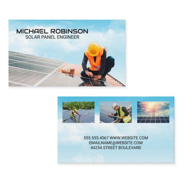 Technician Installing Solar Panel on Roof