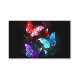 Three Glowing Butterflies on night background