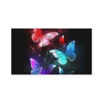 Three Glowing Butterflies on night background