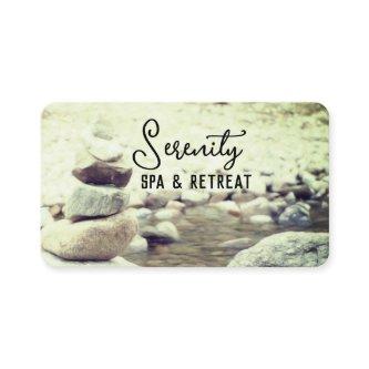tranquil rock cairn and stream nature photo