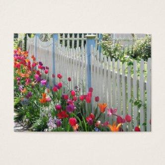 Tulips Garden Along White Picket Fence