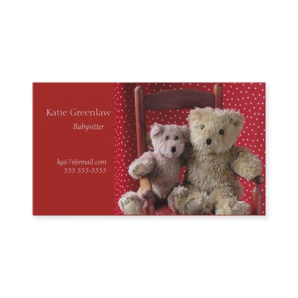 Two teddy bears in a red chair babysitter