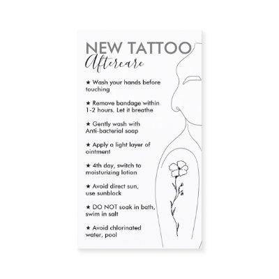 White Flower on Girl Shoulder New Tattoo Aftercare