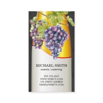Wine Bottle and Grapes on Vine
