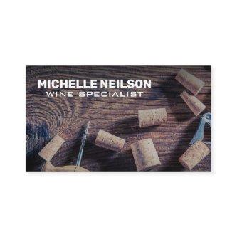 Wine Openers and Corks on Wood Table
